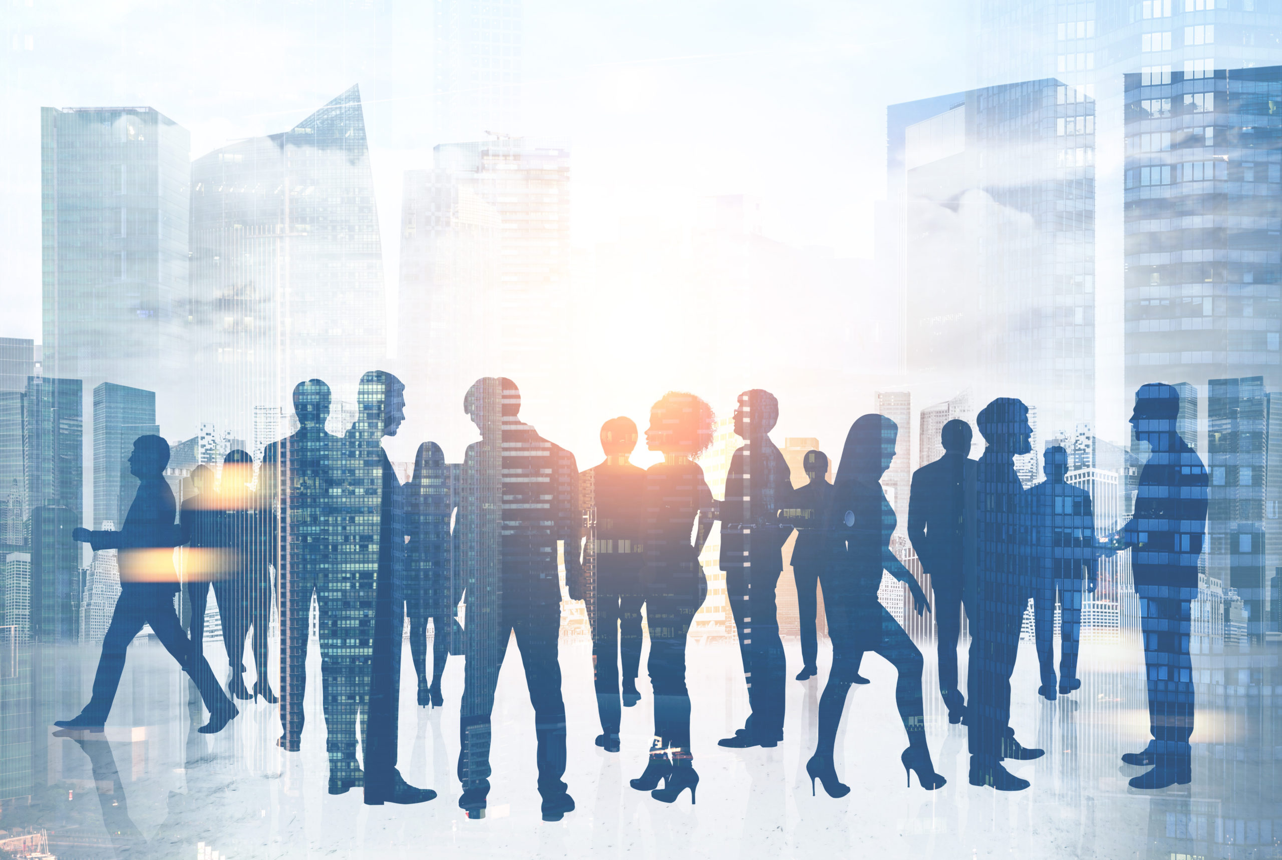 Silhouettes,Of,Business,People,Communicating,A,Against,A,Modern,City